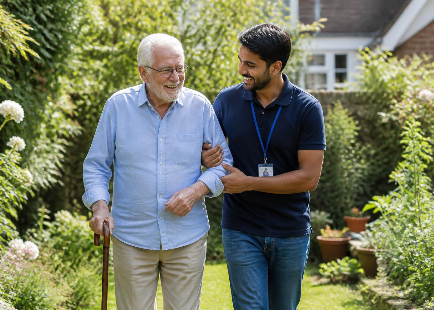 A care worker walking arm in arm with a smiling older man through a sunny garden